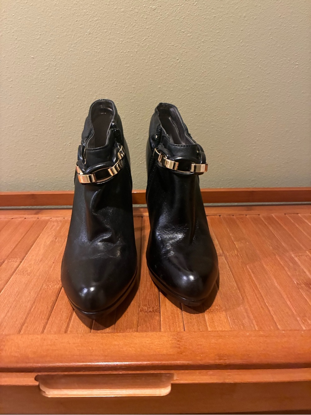 Calvin Klein Black Ankle Booties with Gold Chain Accent